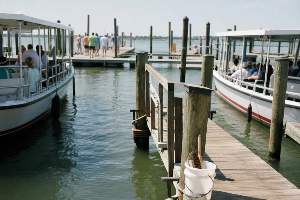 Charleston harbor with small boats at various piers, no text, no logos, no people