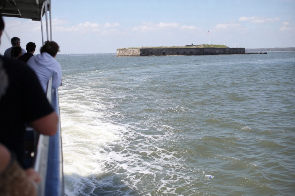 A narrated tour boat crossing Charleston Harbor past Fort Sumter, no text, no logos, no people